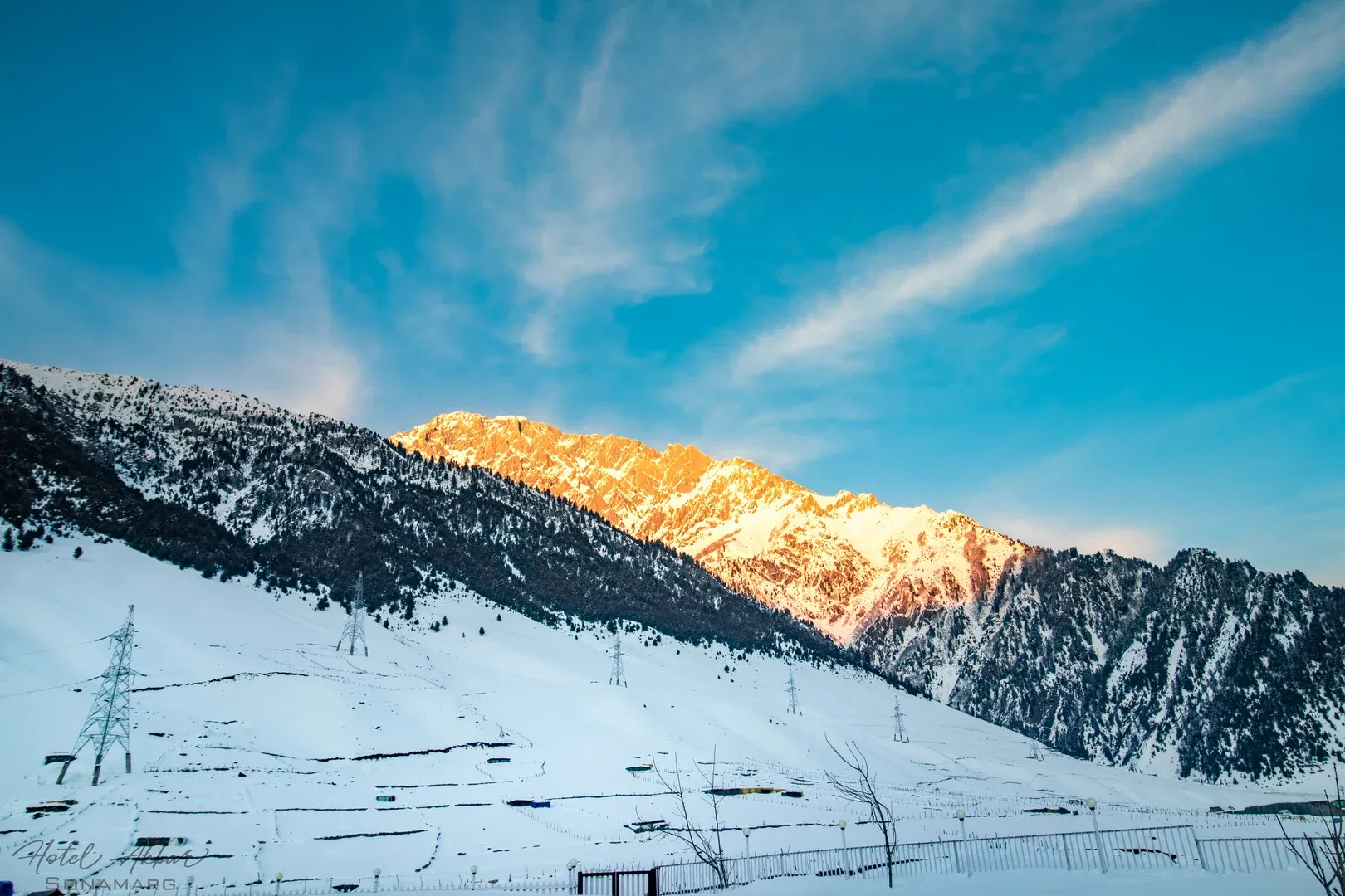 Golden Sunlight Illuminating Snowy Himalayan Peaks.