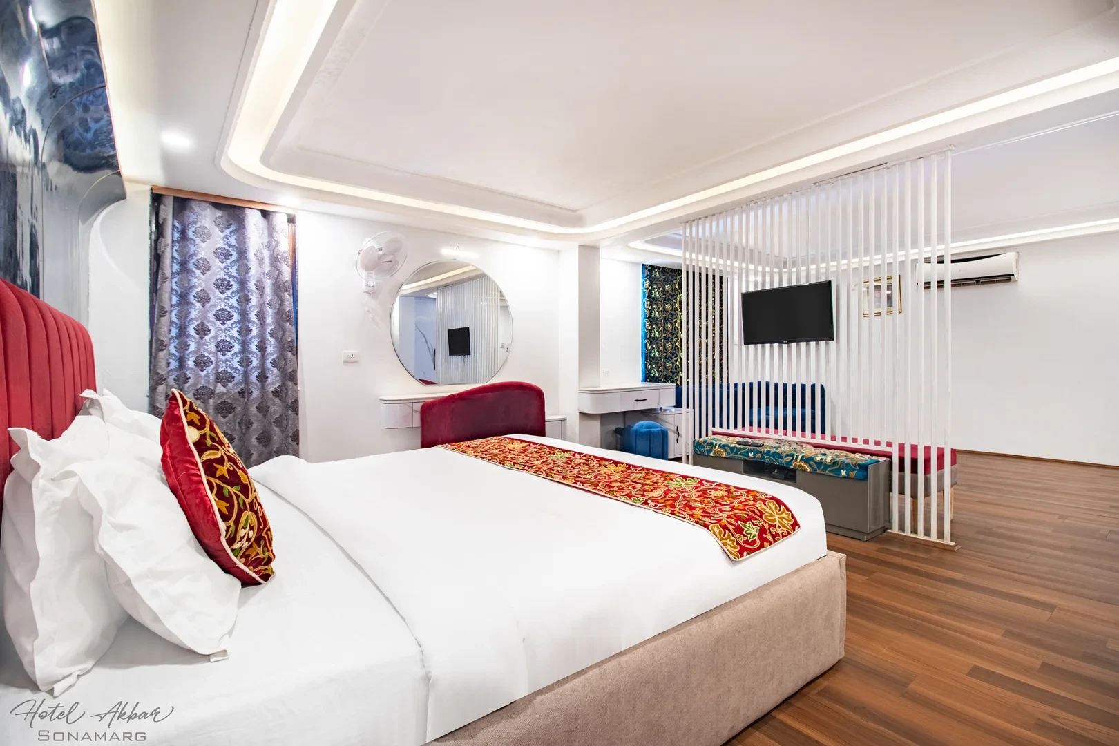 Luxurious Sonmarg hotel bedroom interior view.