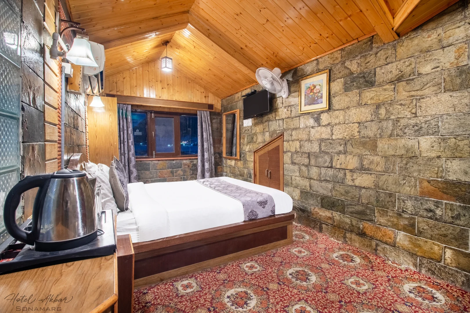 Stone-walled wooden cozy luxury bedroom.